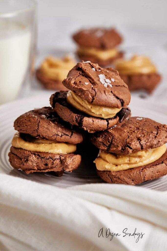 A stack of some homemade peanut butter and chocolate brownie sandwich cookies