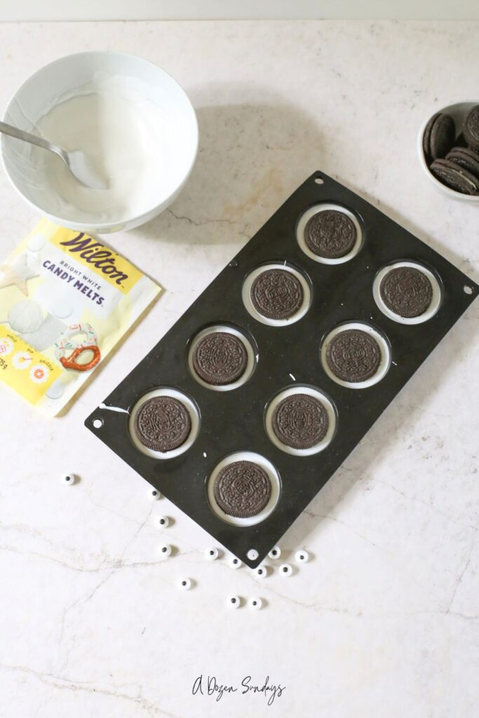 Chocolate covered Oreo Mummies from a recipe on A Dozen Sundays
