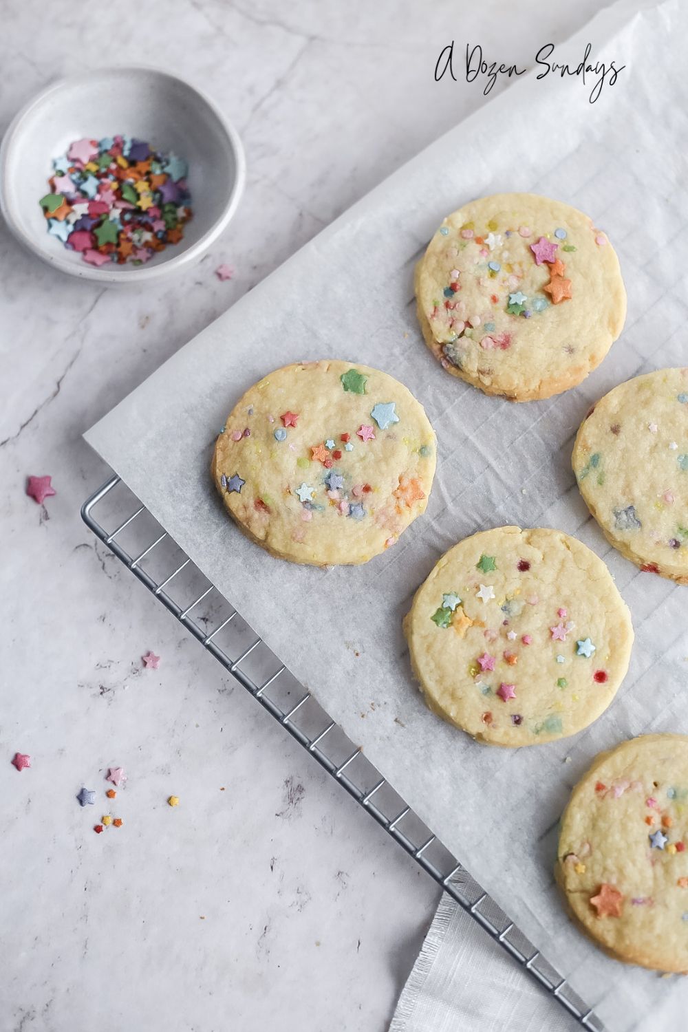 Funfetti cookies - sprinkles cookies on a wire cooling rack