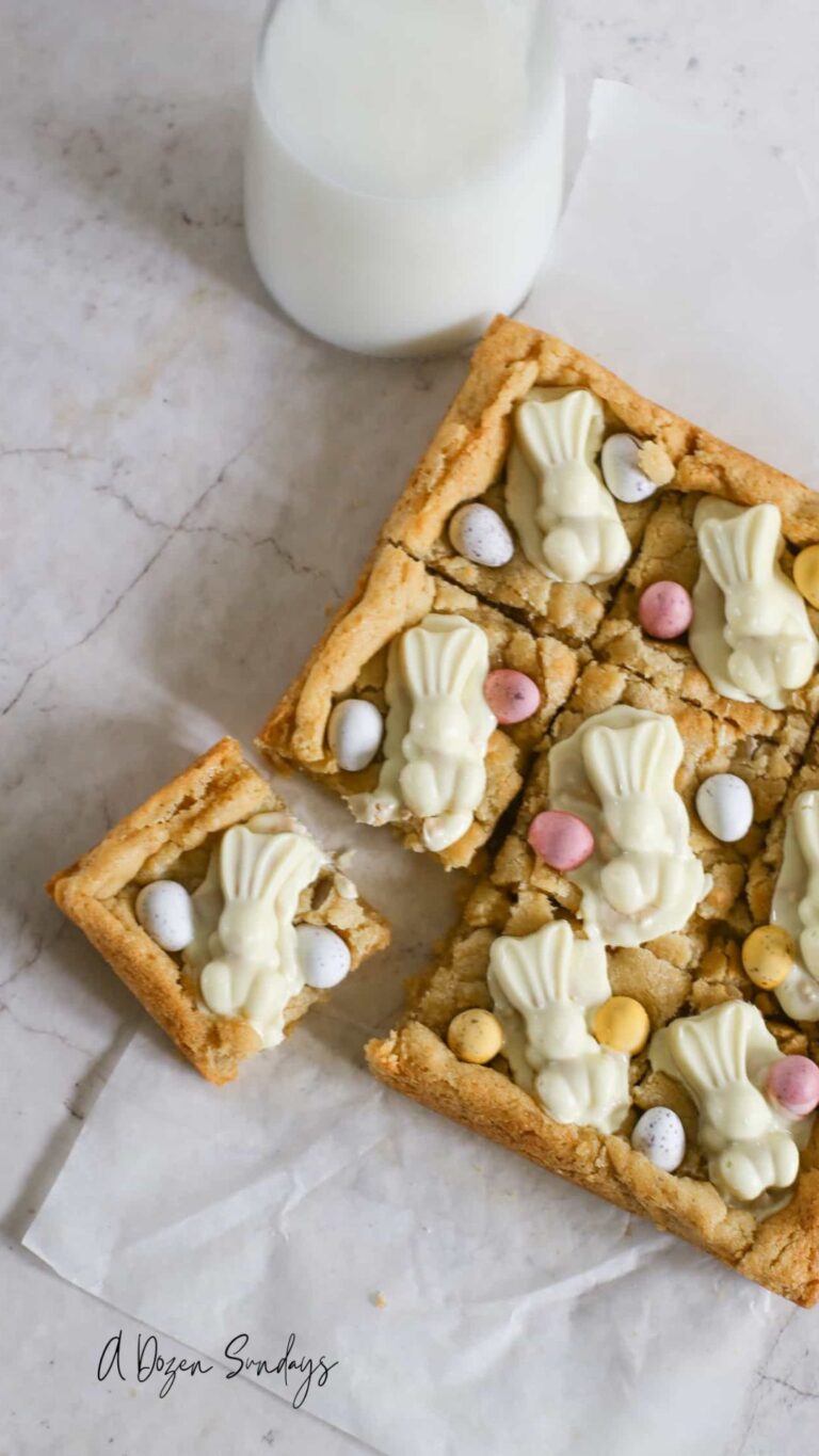 A portion of an Easter Mini Egg cookie bar slightly away from the rest of the bake