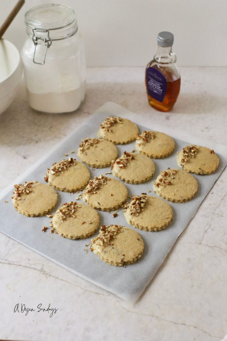 Pumpkin Spice Pecan Shortbread Cookies With Maple Glaze on a baking sheet