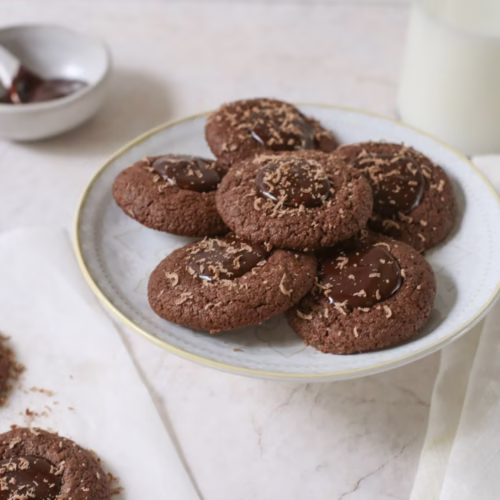 A white plate with Double Chocolate Thumbprint Cookies on